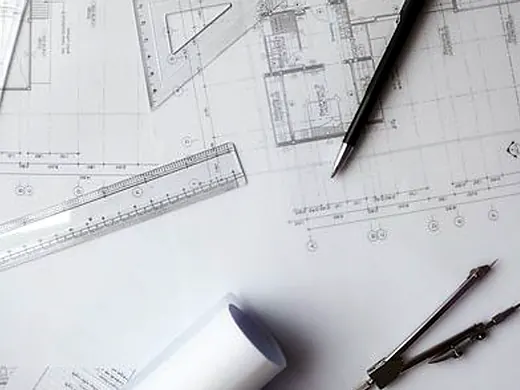 Floor plans, ruler and pencil on a desk