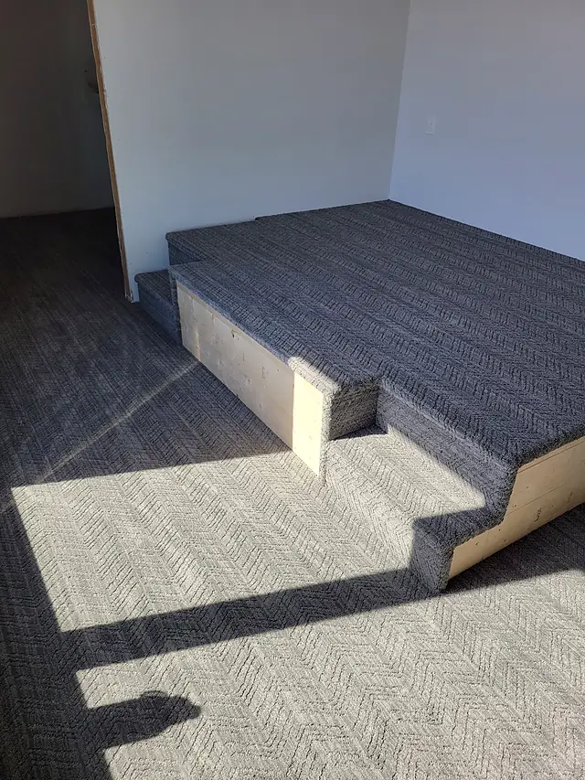 Patterned carpet on a raised platform