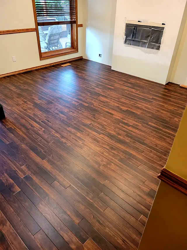 Living room with dark reddish-brown plank flooring